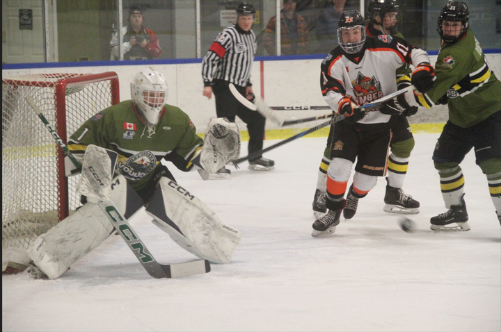 Hearst Over Powassan in OT